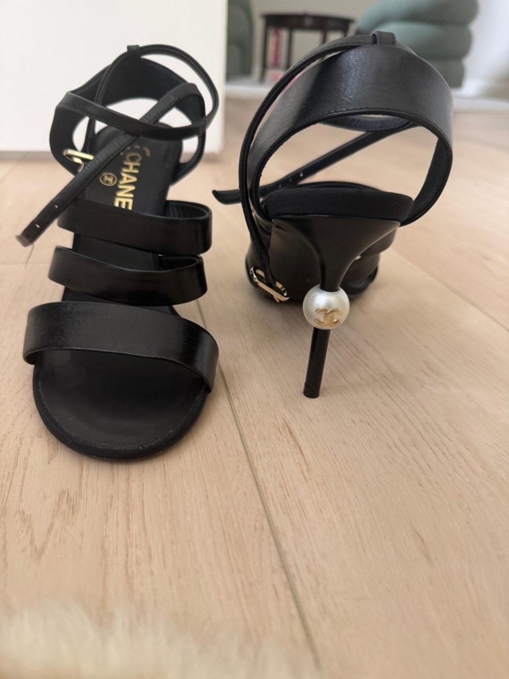 CHANEL Black Leather Strappy Sandals with Pearl Heel Accent